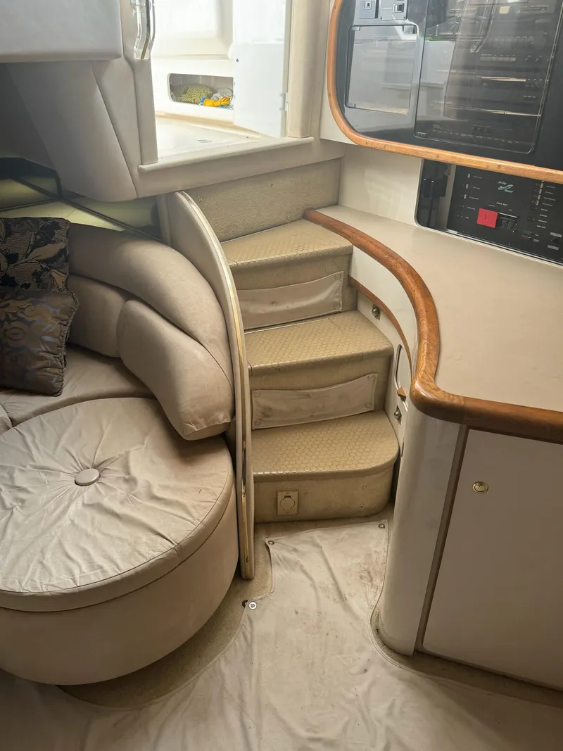 Slide: The Image of Interior of 1995 Sea Ray 500 yacht with curved seating and steps. - 9