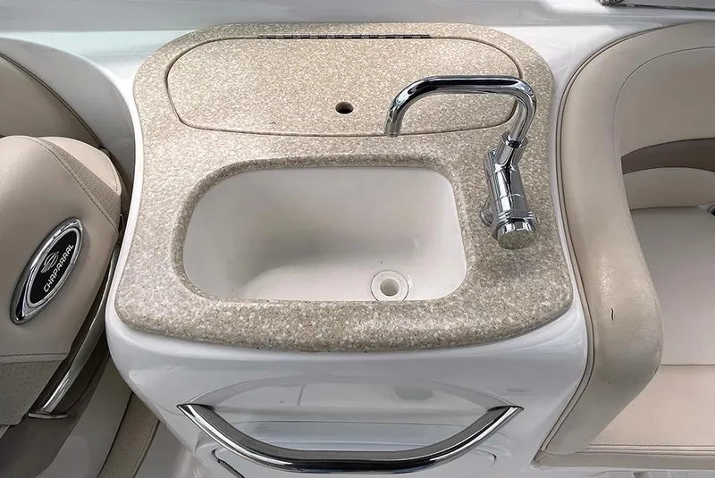 Slide: The Image of 2007 Chaparral 256 SSi boat sink and faucet in beige countertop. - 6