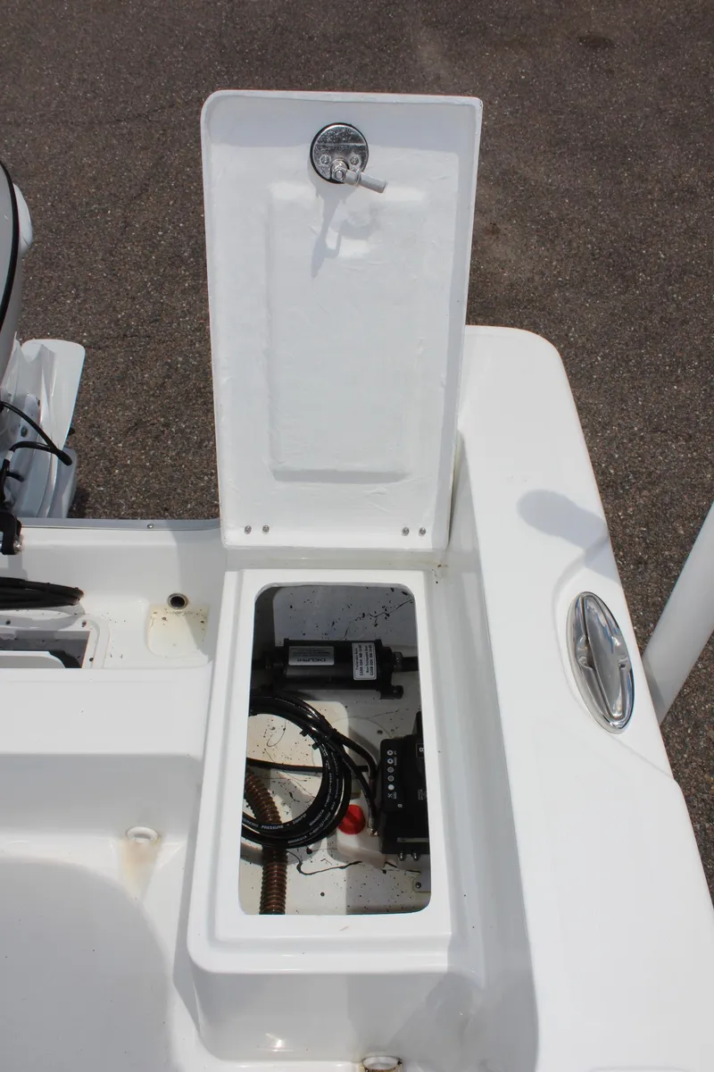 Slide: The Image of Open storage compartment on a 2024 Clearwater 1900 boat. - 10