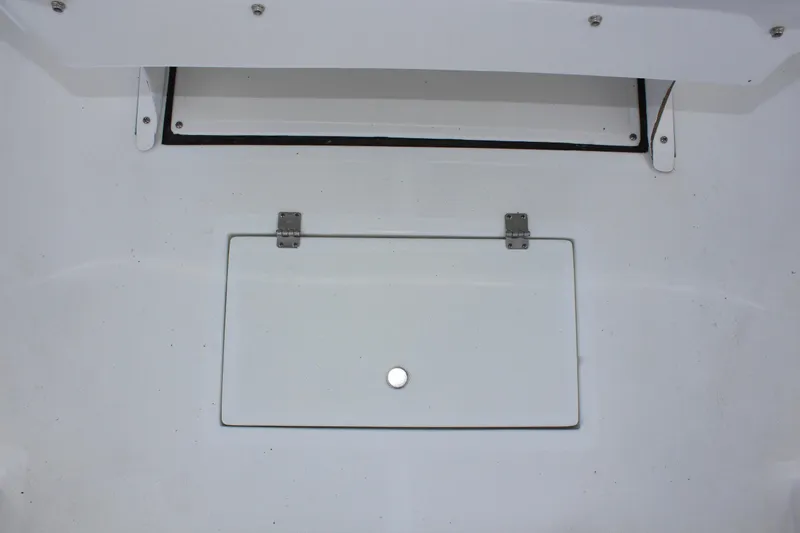 Slide: The Image of Clearwater 1900 2024 boat storage compartment with hinged lid. - 12