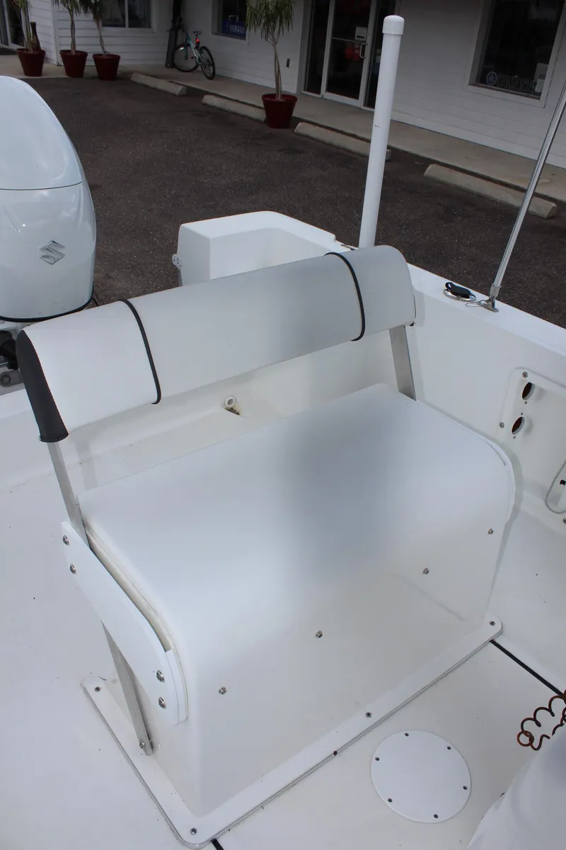 Slide: The Image of 2024 Clearwater 1900 boat seating area with white cushioned bench. - 16