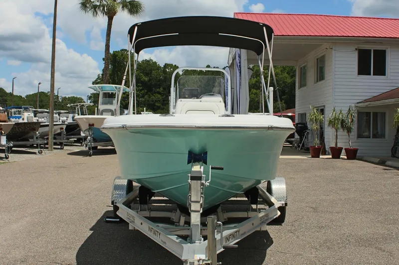 Slide: The Image of 2024 Clearwater 1900 boat on a trailer at a dealership. - 2