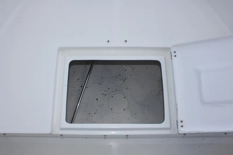 Slide: The Image of Open storage compartment on a 2024 Clearwater 1900 boat. - 21