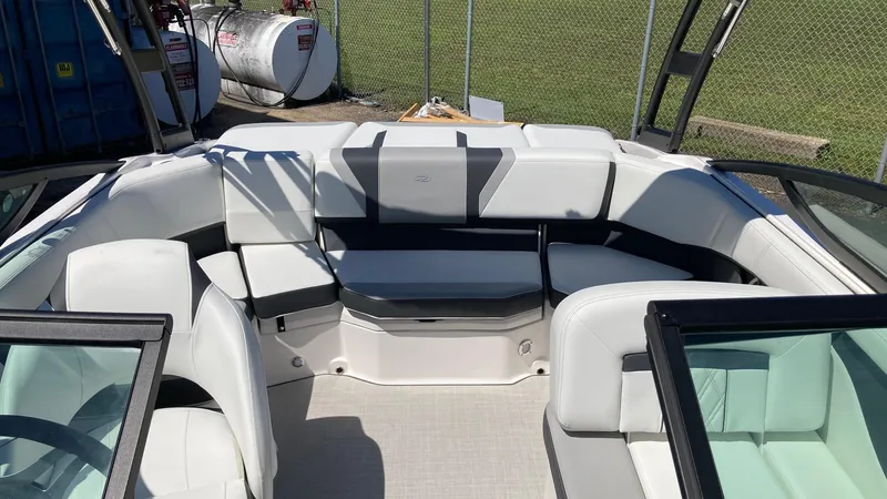 Slide: The Image of 2024 Regal 2000 ES boat interior with white seating and open bow design. - 3