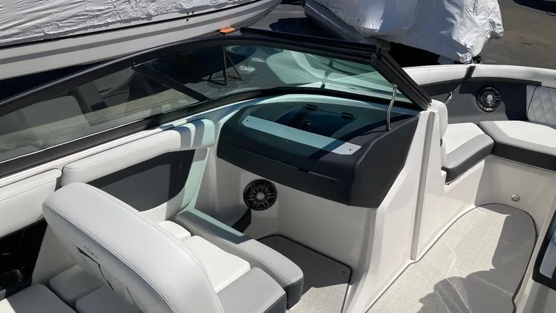 Slide: The Image of 2024 Regal 2000 ES boat interior with white and gray seating. - 4