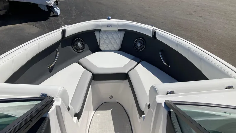 Slide: The Image of 2024 Regal 2000 ES boat interior with cushioned seating and built-in speakers. - 6