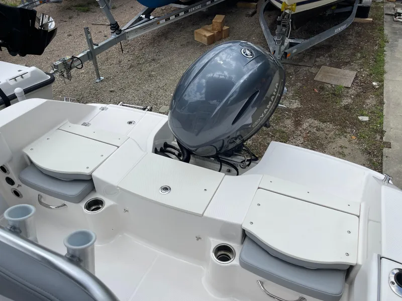 Slide: The Image of 2021 Robalo R180 Center Console boat with outboard motor and seating. - 16