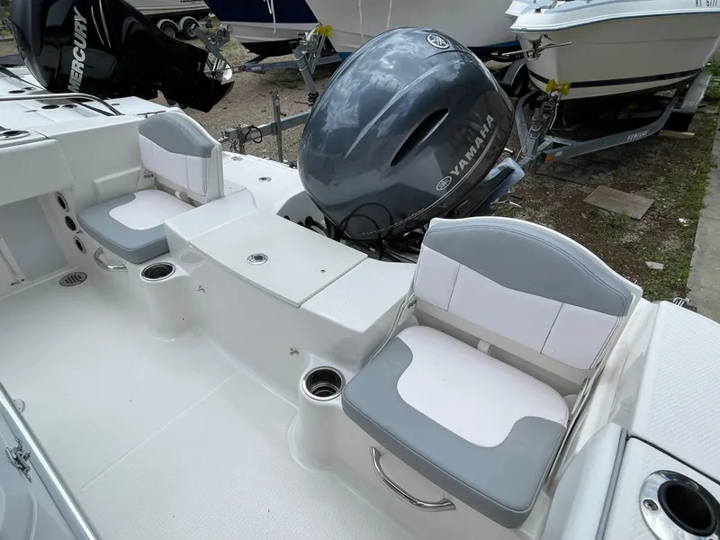 Slide: The Image of 2021 Robalo R180 Center Console boat interior with Yamaha engine and seating. - 21