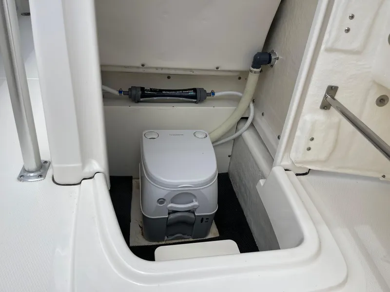 Slide: The Image of 2021 Robalo R180 Center Console boat with built-in portable toilet. - 30