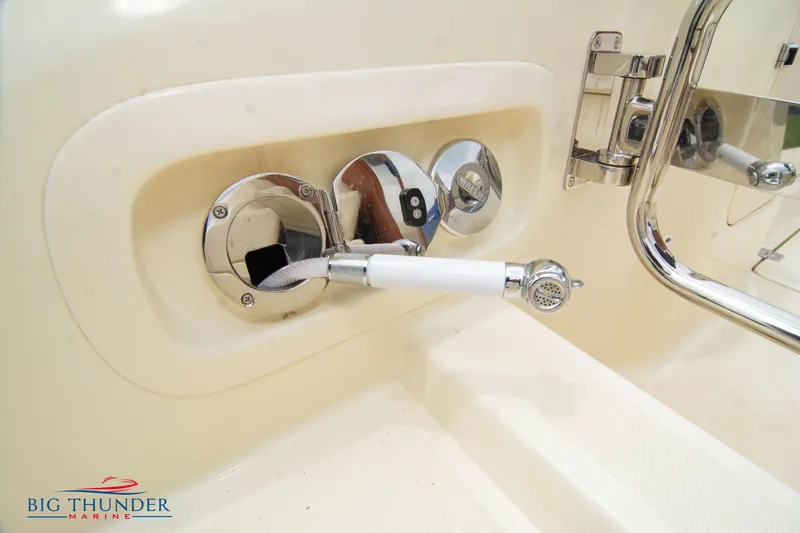 Slide: The Image of Close-up of 2024 Capoforte CX280i boat's control panel and handle. - 11