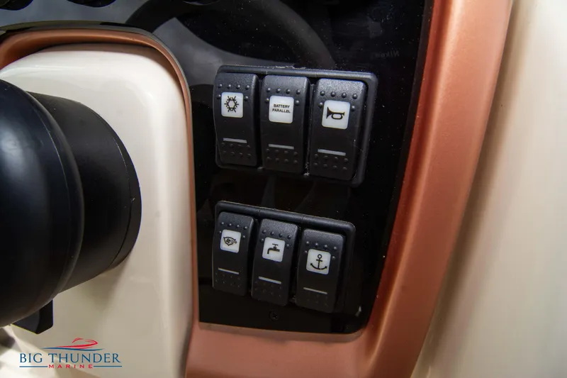 Slide: The Image of Control panel of 2024 Capoforte CX280i boat with various switches. - 31