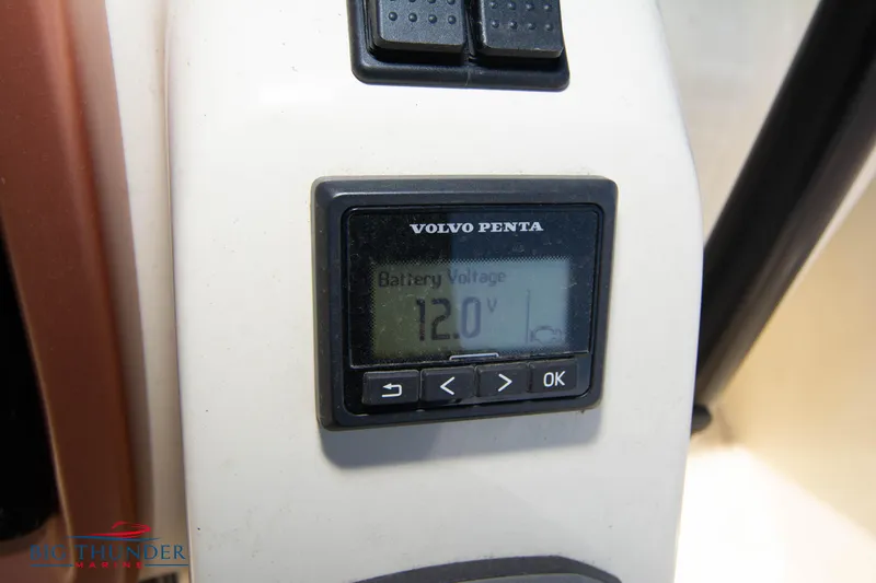 Slide: The Image of Volvo Penta battery voltage display showing 12.0V on Capoforte CX280i 2024 model. - 34