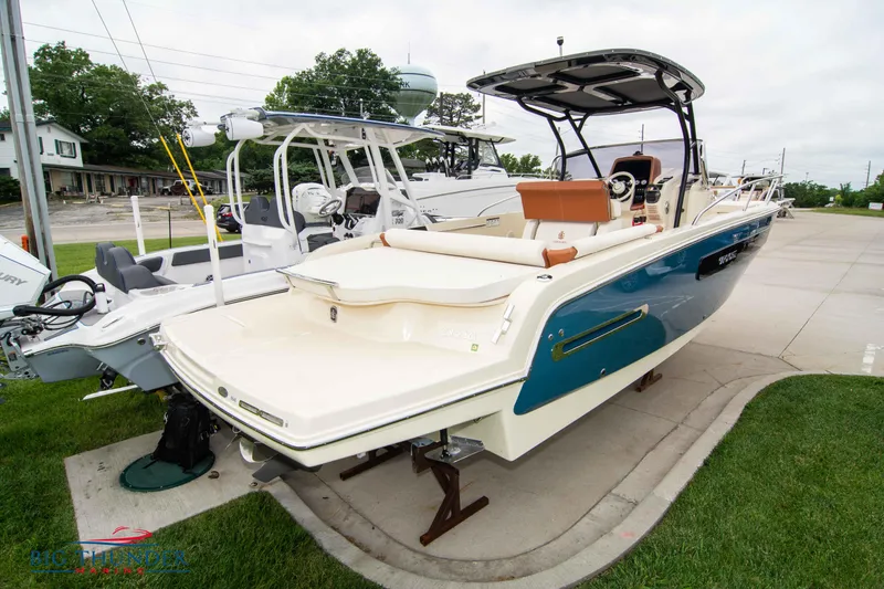 Slide: The Image of 2024 Capoforte CX280i boat on display at a marina. - 4