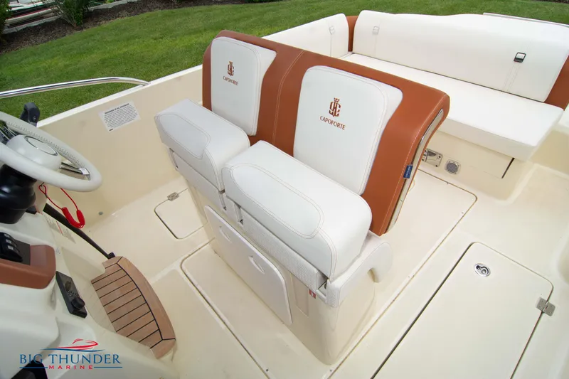 Slide: The Image of 2024 Capoforte CX280i boat interior with white and brown seating. - 41