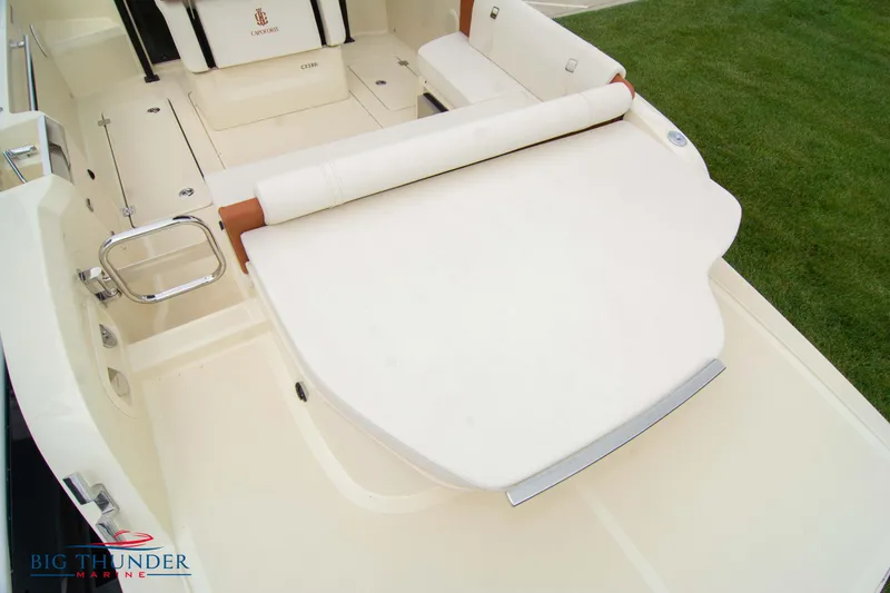 Slide: The Image of 2024 Capoforte CX280i boat interior with white seating and deck. - 9