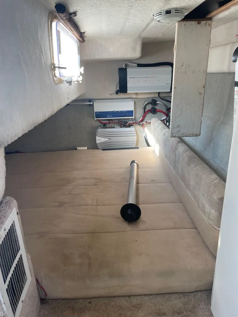 Slide: The Image of 1994 Bayliner 2655 Ciera cabin interior with beige upholstery and equipment. - 14