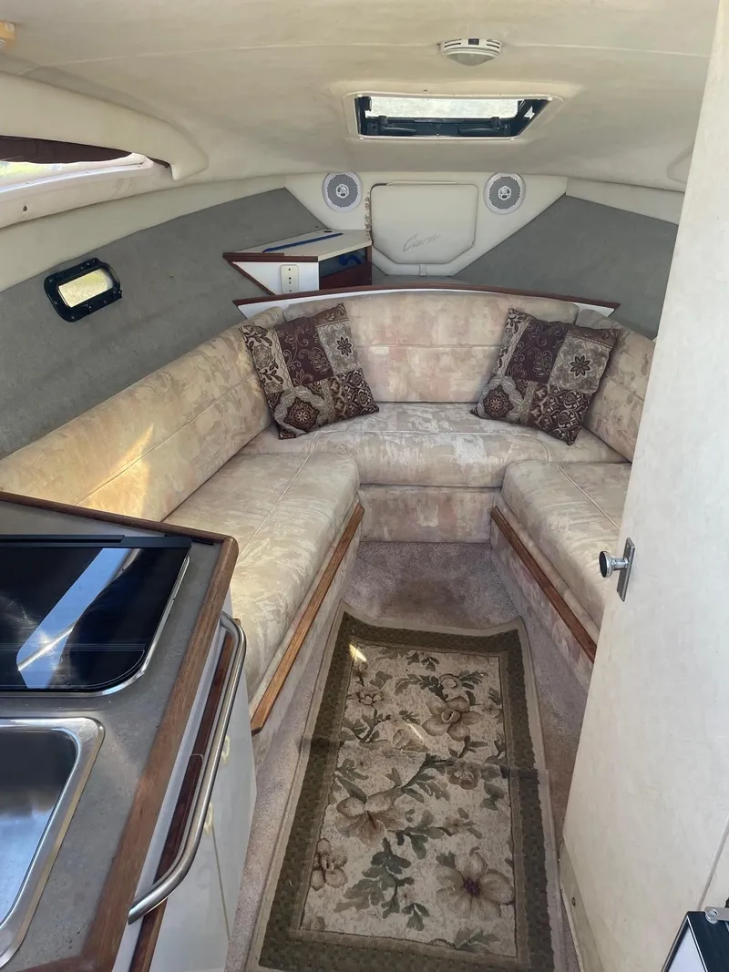 Slide: The Image of 1994 Bayliner 2655 Ciera cabin interior with seating and kitchenette. - 9