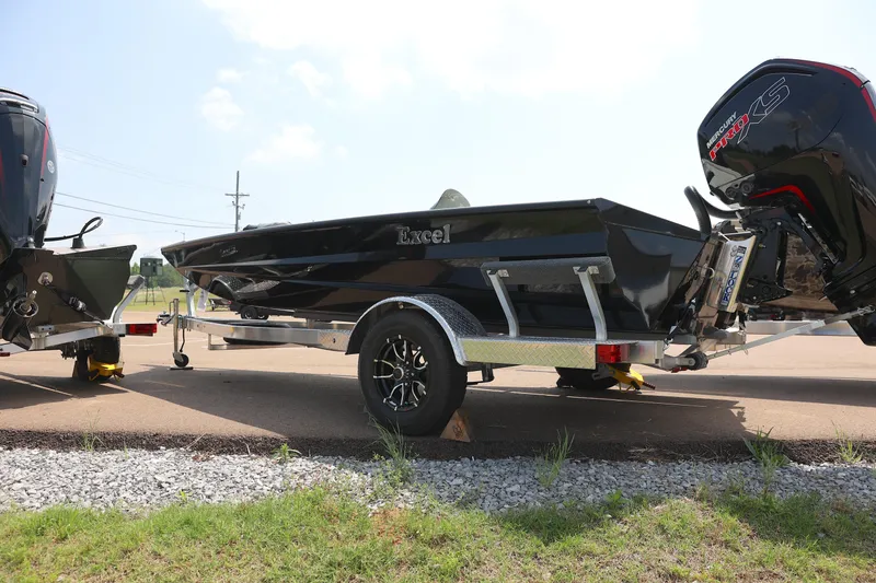 Slide: The Image of 2024 Excel 1860 Stalker SC boat on a trailer, side view. - 2