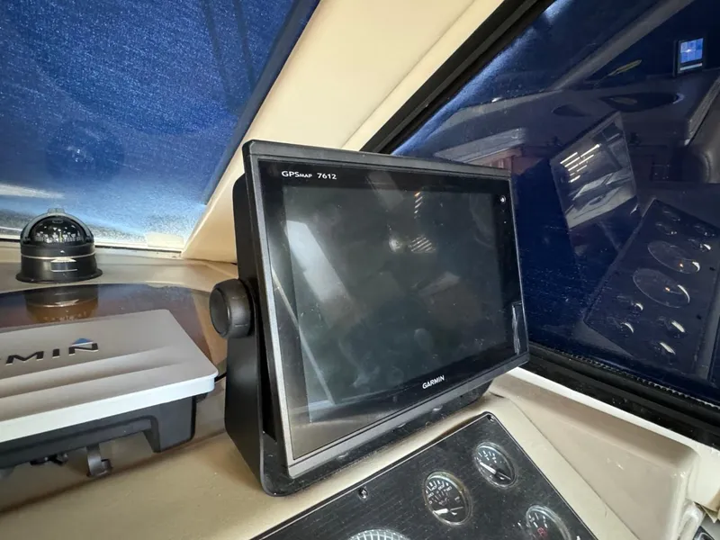 Slide: The Image of 1999 Bayliner 4087 Aft Cabin Motor Yacht helm with Garmin GPSmap 7612 and navigation instruments. - 19