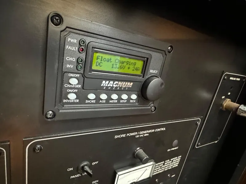 Slide: The Image of Control panel of a 1999 Bayliner 4087 Aft Cabin Motor Yacht, displaying float charging status. - 22