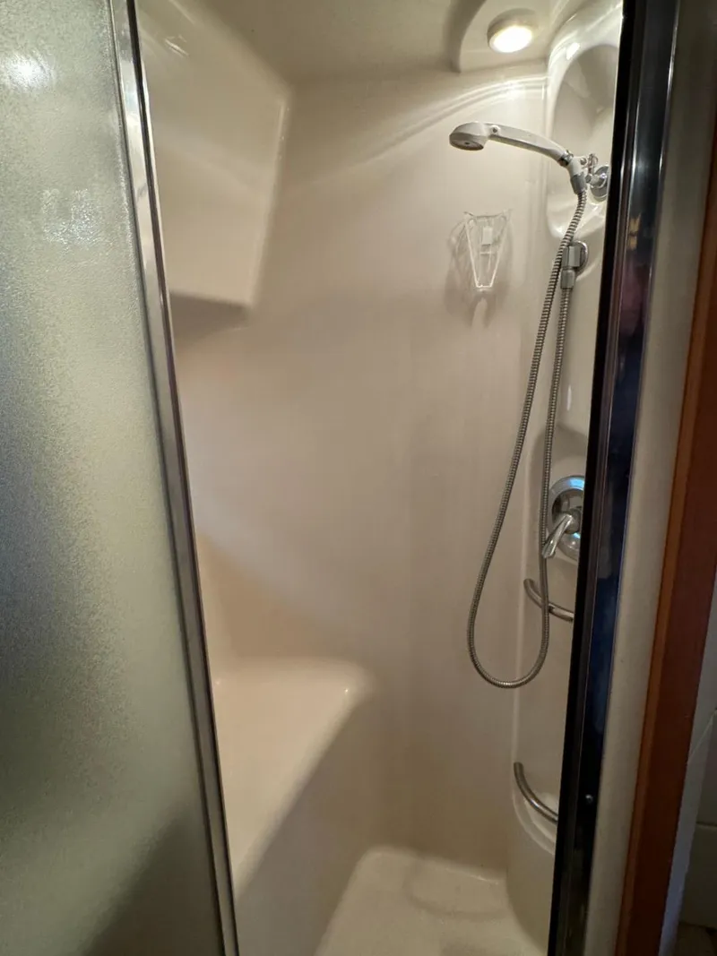 Slide: The Image of Shower area in 1999 Bayliner 4087 Aft Cabin Motor Yacht, featuring modern fixtures. - 26