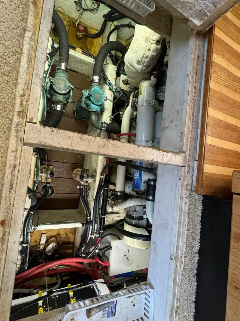 Slide: The Image of Engine room of 1999 Bayliner 4087 Aft Cabin Motor Yacht, showing mechanical components and wiring. - 38