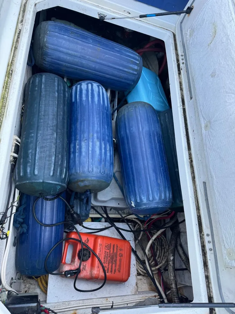 Slide: The Image of Storage compartment of 1999 Bayliner 4087 Aft Cabin Motor Yacht with blue fenders and equipment. - 40