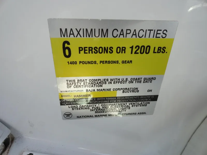 Slide: The Image of 1998 Baja Boss Hammer boat capacity label, 6 persons or 1200 lbs, US Coast Guard compliant. - 10