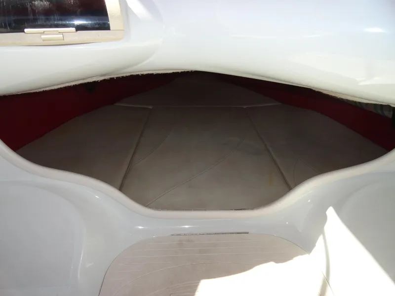 Slide: The Image of Interior cabin of a 1998 Baja Boss Hammer boat with white and red upholstery. - 15
