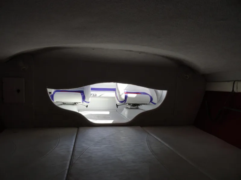 Slide: The Image of Interior cabin view of a 1998 Baja Boss Hammer boat. - 16