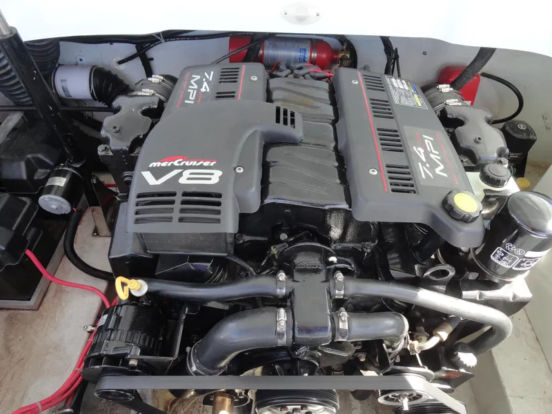 Slide: The Image of 1998 Baja Boss Hammer engine compartment with MerCruiser V8 engine. - 18