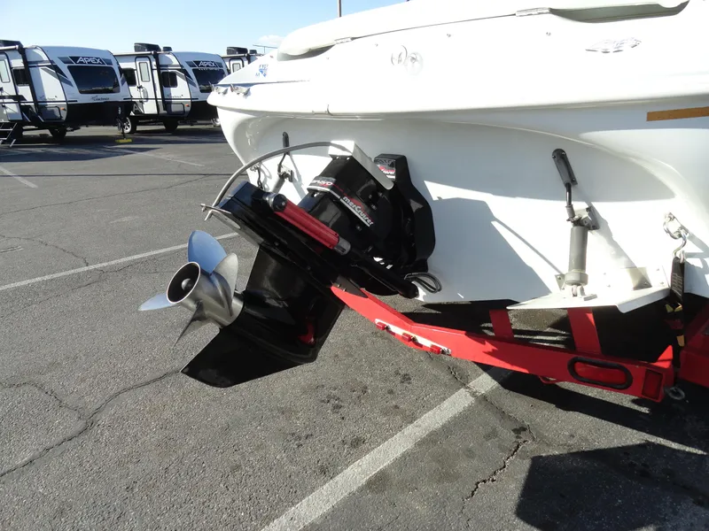 Slide: The Image of 1998 Baja Boss Hammer boat with outboard motor in parking lot. - 25