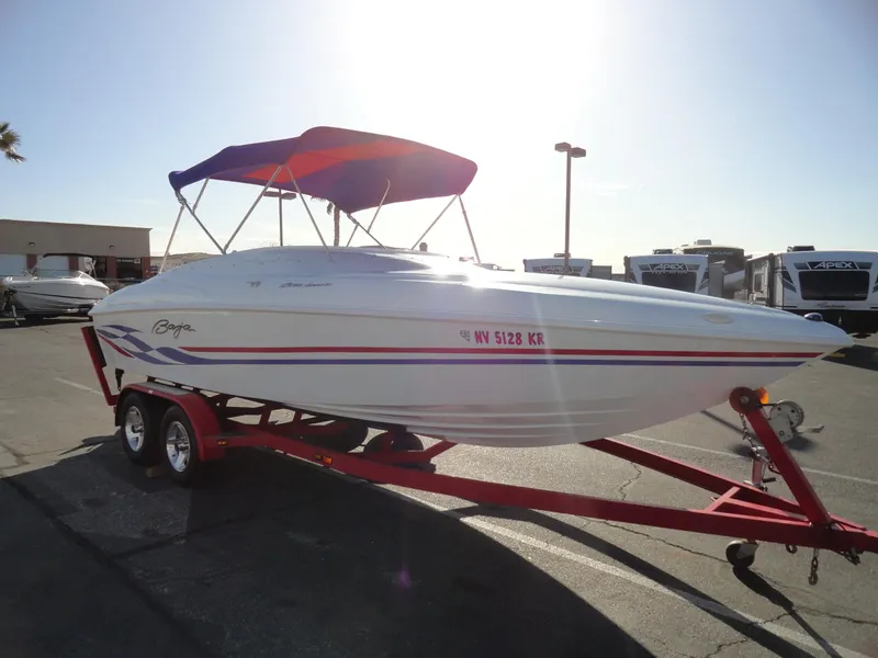 Slide: The Image of 1998 Baja Boss Hammer speedboat with trailer, purple canopy, and red accents. - 4