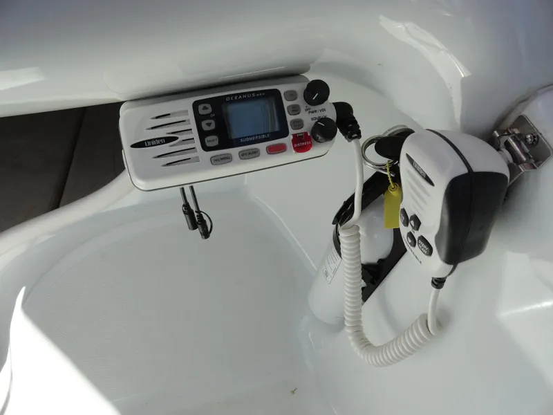 Slide: The Image of VHF marine radio and microphone in a 1998 Baja Boss Hammer boat. - 9