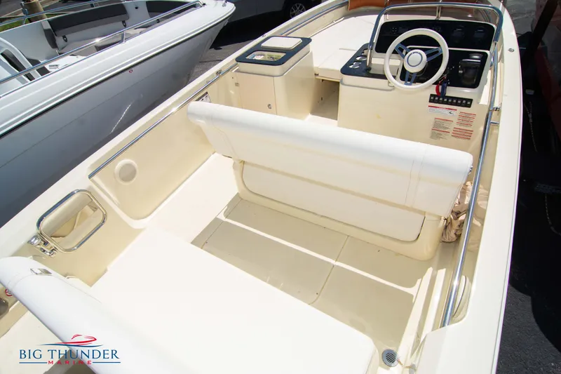 Slide: The Image of 2024 Capoforte SX200 boat interior with steering wheel and seating. - 10