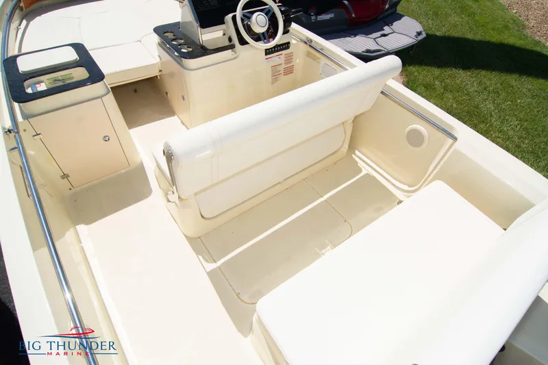Slide: The Image of 2024 Capoforte SX200 boat interior with seating and steering console. - 11