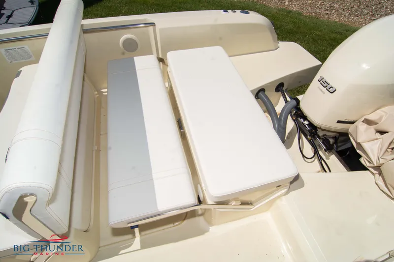 Slide: The Image of 2024 Capoforte SX200 boat interior with seating and 150 HP outboard motor. - 13
