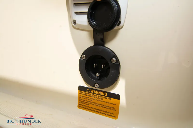 Slide: The Image of Close-up of Capoforte SX200 2024 power outlet with warning label. - 14