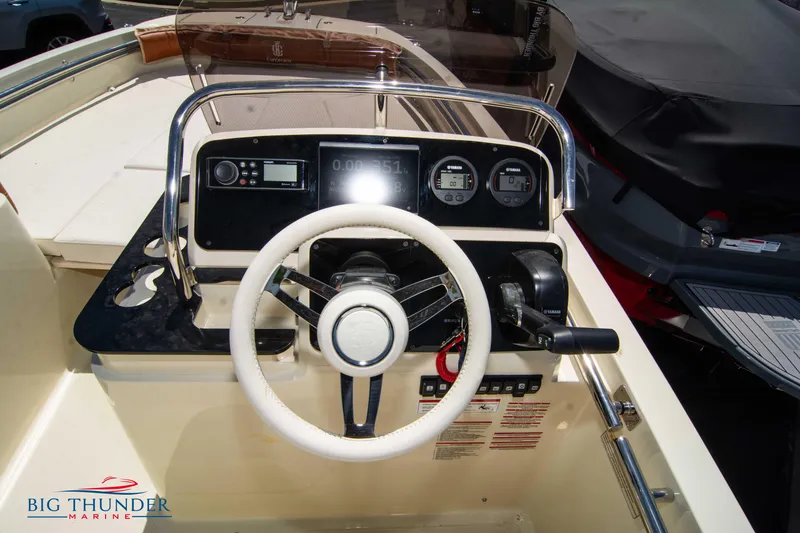 Slide: The Image of 2024 Capoforte SX200 boat dashboard and steering wheel at Big Thunder Marine. - 16