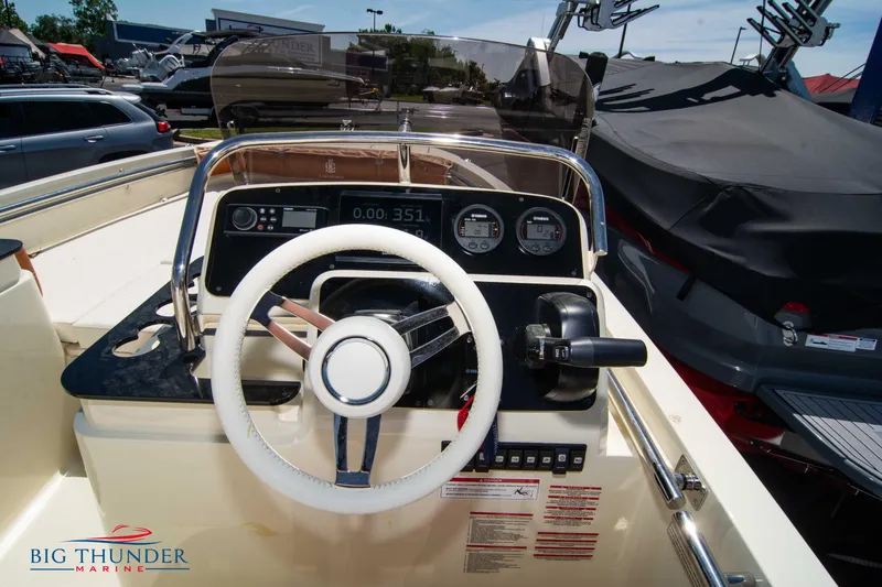 Slide: The Image of 2024 Capoforte SX200 boat dashboard and steering wheel at Big Thunder Marine. - 17