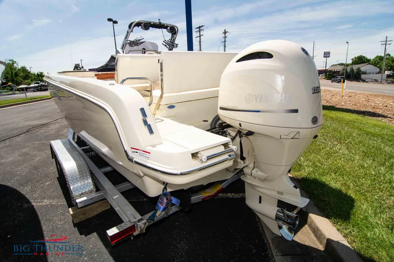 Slide: The Image of 2024 Capoforte SX200 boat with Yamaha outboard engine on trailer. - 2
