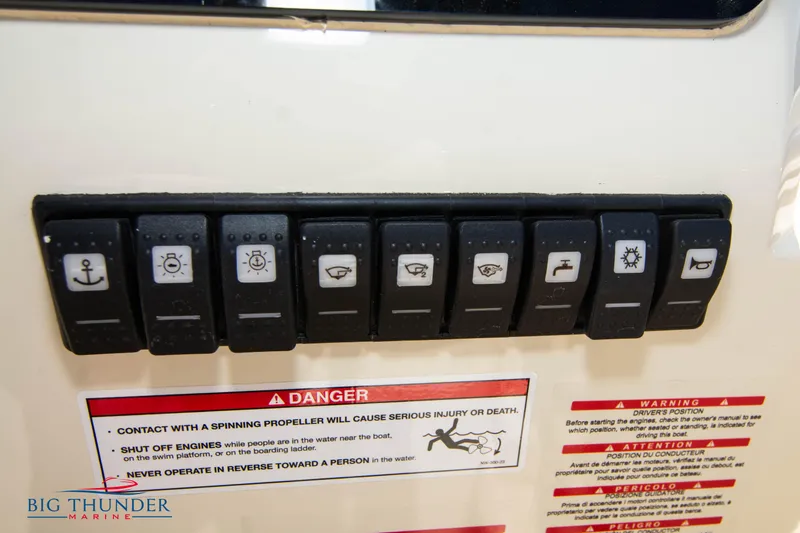 Slide: The Image of Control panel of a 2024 Capoforte SX200 boat with various switches and safety warnings. - 21