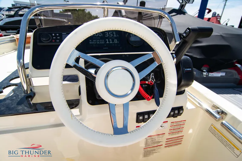 Slide: The Image of Steering wheel and dashboard of 2024 Capoforte SX200 boat at Big Thunder Marine. - 23