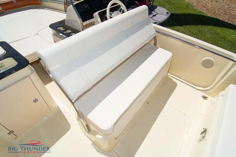 Slide: The Image of Capoforte SX200 2024 boat interior with white seating and steering console. - 25