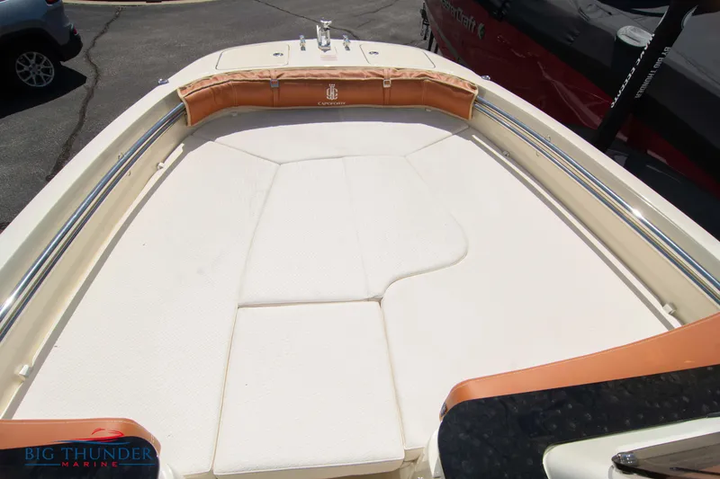 Slide: The Image of 2024 Capoforte SX200 boat deck with cushioned seating and stainless steel railings. - 29