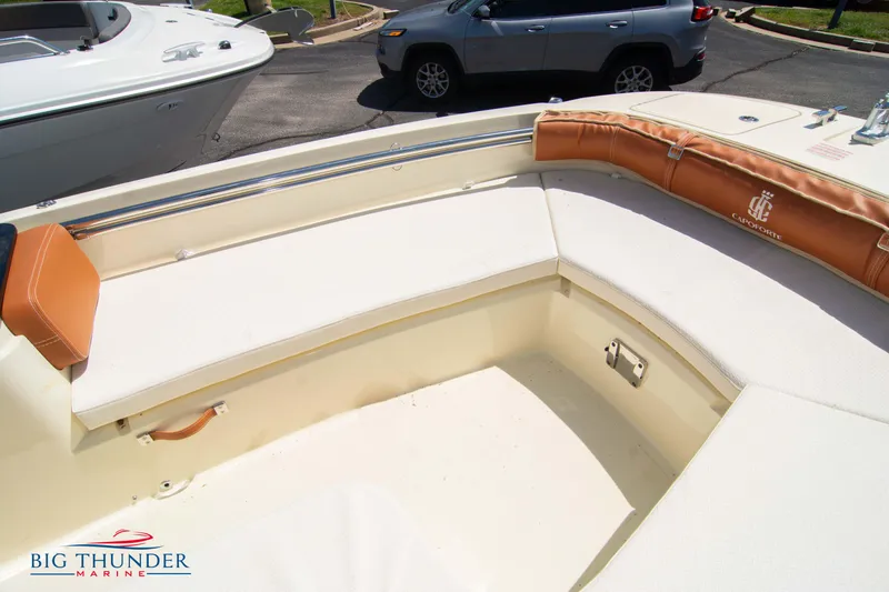 Slide: The Image of 2024 Capoforte SX200 boat interior with white seating and brown accents at Big Thunder Marine. - 32
