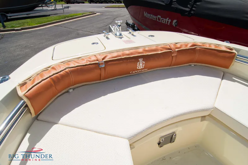 Slide: The Image of 2024 Capoforte SX200 boat interior with cushioned seating and branded padding. - 33