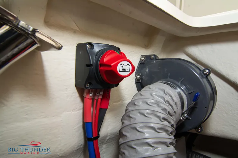 Slide: The Image of Battery switch and wiring inside a 2024 Capoforte SX200 boat. - 36