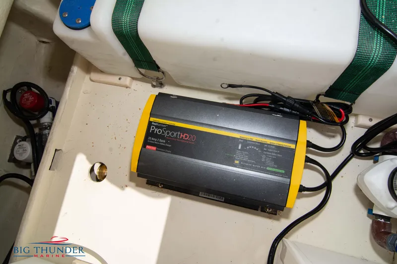 Slide: The Image of Battery charger in the engine compartment of a 2024 Capoforte SX200 boat. - 37