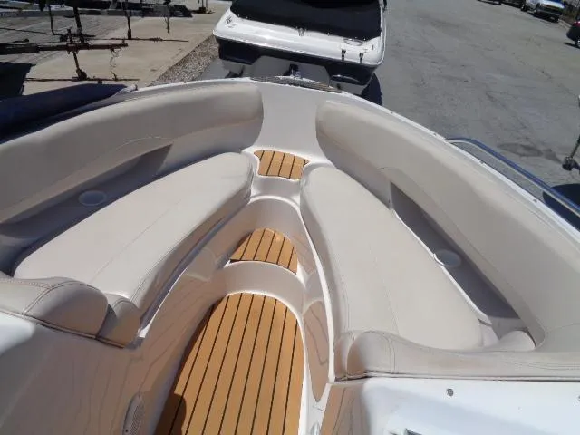 Slide: The Image of 1996 Four Winns 240 Horizon boat with spacious seating and teak flooring. - 14